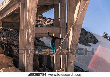 Woman highlining, Donner Pass, Truckee, California, USA View Large Photo Image Picture - Woman highlining, Donner Pass, Truckee, California, USA. Fotosearch