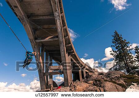 Stock Photo - Woman highlining, Donner Pass, Truckee, California, USA. Fotosearch