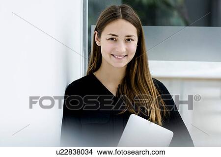 Woman holding digital tablet View Large Photo Image Picture - Woman holding digital tablet. Fotosearch