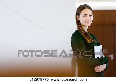 Stock Photography - Woman holding digital tablet. Fotosearch