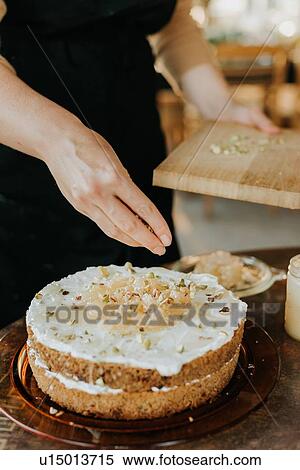 Woman in apron baking vegetarian cake View Large Photo Image Stock Photography - Woman in apron baking vegetarian cake. Fotosearch