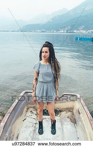 Woman in boat on lake, Como, Lombardia, Italy View Large Photo Image Stock Photo - Woman in boat on lake, Como, Lombardia, Italy. Fotosearch
