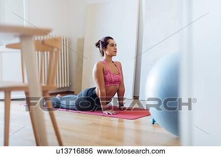 Woman in cobra pose View Large Photo Image Stock Photograph - Woman in cobra pose. Fotosearch