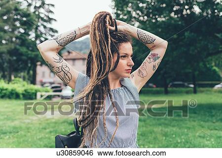 Stock Photograph - Woman in park. Fotosearch