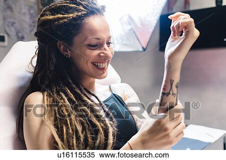 Woman in tattoo parlour View Large Photo Image Stock Photography - Woman in tattoo parlour. Fotosearch