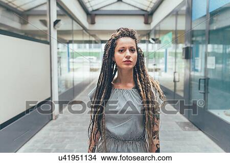 Woman inside building View Large Photo Image Picture - Woman inside building. Fotosearch
