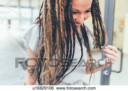 Stock Photograph - Woman inside building. Fotosearch