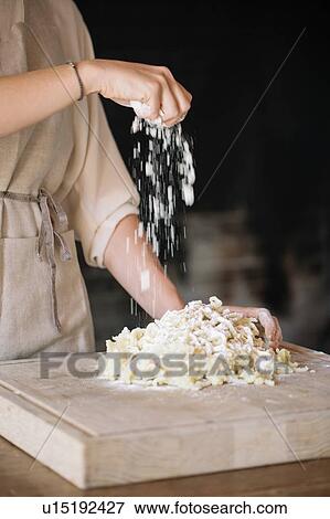Woman mixing dough for gnocchi View Large Photo Image Stock Photo - Woman mixing dough for gnocchi. Fotosearch