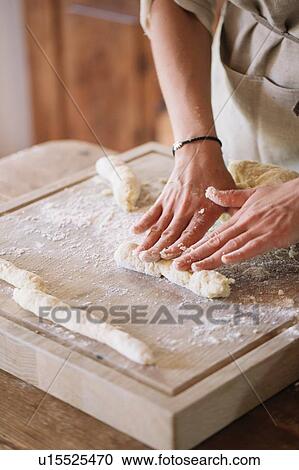 Woman preparing dough for gnocchi View Large Photo Image Stock Image - Woman preparing dough for gnocchi. Fotosearch