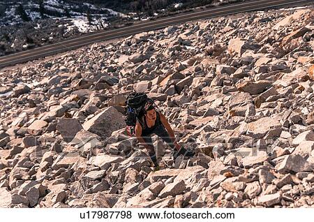 Woman rock climbing, Cardinal Pinnacle, Bishop, California, USA View Large Photo Image Stock Photo - Woman rock climbing, Cardinal Pinnacle, Bishop, California, USA. Fotosearch