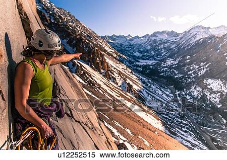 Stock Photography - Woman rock climbing, Cardinal Pinnacle, Bishop, California, USA. Fotosearch