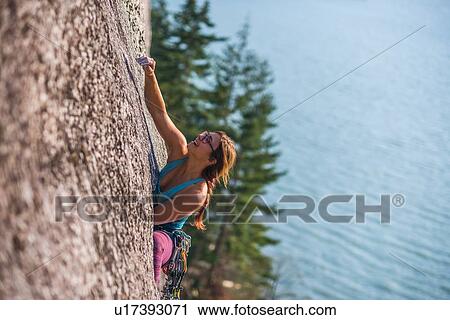 Woman rock climbing, Malamute, Squamish, Canada View Large Photo Image Stock Image - Woman rock climbing, Malamute, Squamish, Canada. Fotosearch