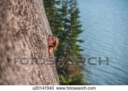 Woman rock climbing, Malamute, Squamish, Canada View Large Photo Image Stock Image - Woman rock climbing, Malamute, Squamish, Canada. Fotosearch
