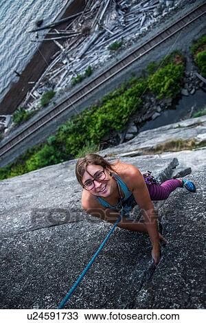 Woman rock climbing, Malamute, Squamish, Canada View Large Photo Image Stock Image - Woman rock climbing, Malamute, Squamish, Canada. Fotosearch