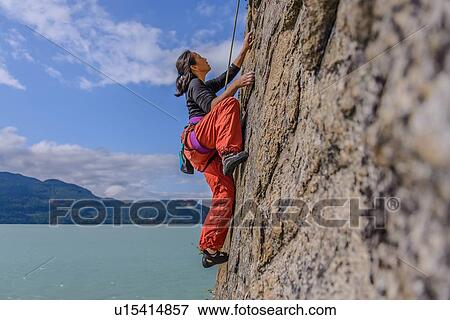 Woman rock climbing, Squamish, Canada View Large Photo Image Stock Photo - Woman rock climbing, Squamish, Canada. Fotosearch