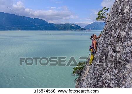 Woman rock climbing, Squamish, Canada View Large Photo Image Stock Photo - Woman rock climbing, Squamish, Canada. Fotosearch