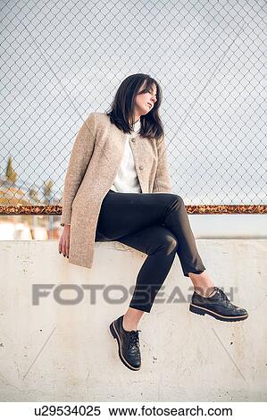 Woman sleeping against wire fence View Large Photo Image Stock Photography - Woman sleeping against wire fence. Fotosearch
