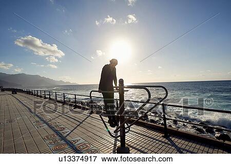 Woman using outdoor exercise machine on 0omenade, Las Palmas, Gran Canaria, Canary Islands, Spain View Large Photo Image Stock Photo - Woman using outdoor exercise machine on 0omenade, Las Palmas, Gran Canaria, Canary Islands, Spain. Fotosearch