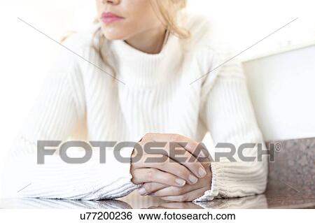 Woman with one hand on top of the other View Large Photo Image Stock Photograph - Woman with one hand on top of the other. Fotosearch