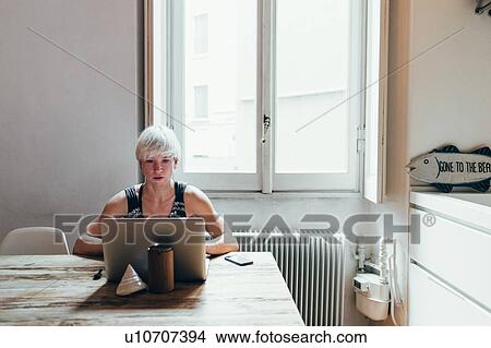 Woman working at home View Large Photo Image Picture - Woman working at home. Fotosearch