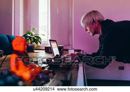 Woman working at home View Large Photo Image Picture - Woman working at home. Fotosearch