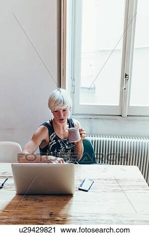 Woman working at home View Large Photo Image Stock Image - Woman working at home. Fotosearch