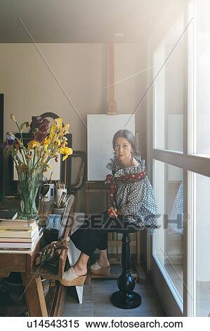 Stock Photography - Woman working in her studio. Fotosearch