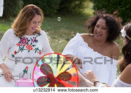 Women having picnic in garden View Large Photo Image Picture - Women having picnic in garden. Fotosearch
