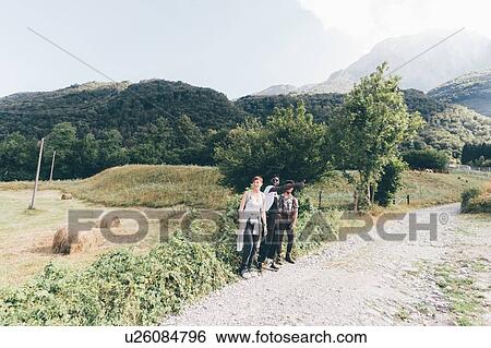 Young adult hiker friends thumbing lift on rural dirt track, Primaluna, Trentino-Alto Adige, Italy View Large Photo Image Stock Photograph - Young adult hiker friends thumbing lift on rural dirt track, Primaluna, Trentino-Alto Adige, Italy. Fotosearch