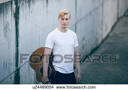 Young musician with guitar View Large Photo Image Picture - Young musician with guitar. Fotosearch