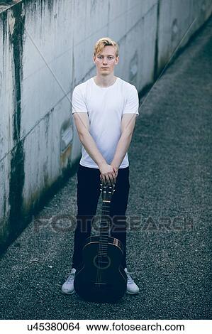 Young musician with guitar View Large Photo Image Picture - Young musician with guitar. Fotosearch