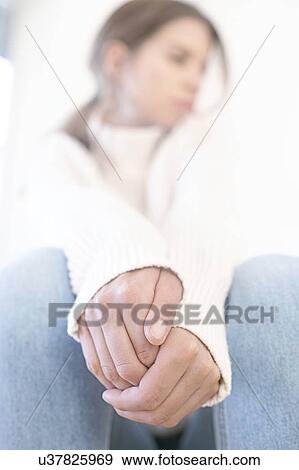 Young woman with hands clasped View Large Photo Image Stock Photo - Young woman with hands clasped. Fotosearch