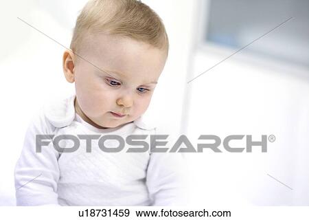 Baby boy looking down. View Large Photo Image Stock Photo - Baby boy looking down.. Fotosearch