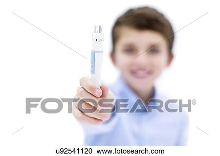 Stock Image - Boy holding finger prick test.. Fotosearch