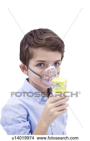 Picture - Boy using nebuliser.. Fotosearch