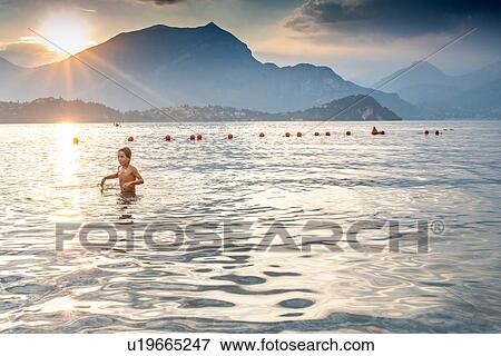 Boy wading in sea View Large Photo Image Stock Photo - Boy wading in sea. Fotosearch