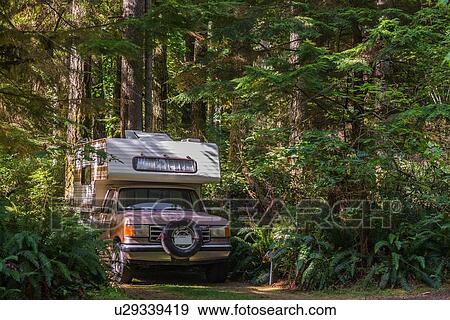 Stock Photo - Camper van parked on forest track, Quadra Island, Campbell River, Canada. Fotosearch