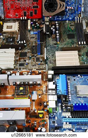 Stock Image - Computer circuit boards showing microchips, transistors and resistors.. Fotosearch