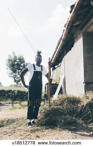 Cool young male agricultural worker with pitchfork, full length portrait View Large Photo Image Stock Photo - Cool young male agricultural worker with pitchfork, full length portrait. Fotosearch