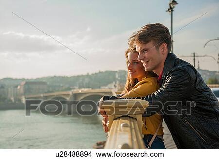 Couple enjoying view from bridge, Budapest, Hungary View Large Photo Image Picture - Couple enjoying view from bridge, Budapest, Hungary. Fotosearch