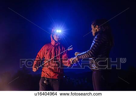 Picture - Couple having barbecue on Nexen Beach, Squamish, Canada. Fotosearch