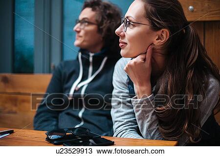 Couple relaxing in cafe View Large Photo Image Stock Image - Couple relaxing in cafe. Fotosearch