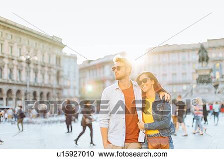 Stock Image - Couple sightseeing, Piazza del Duomo, Milan, Italy. Fotosearch