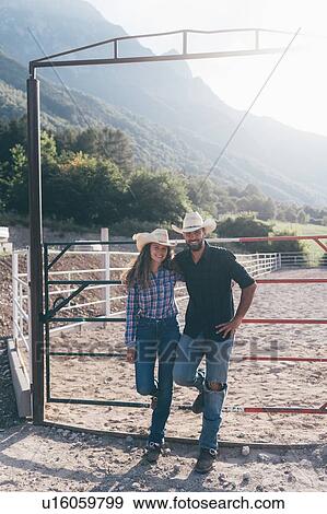 Cowgirl and boyfriend in rural equestrian arena, portrait, Primaluna, Trentino-Alto Adige, Italy View Large Photo Image Stock Photo - Cowgirl and boyfriend in rural equestrian arena, portrait, Primaluna, Trentino-Alto Adige, Italy. Fotosearch