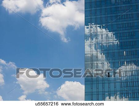 Detail of glass fronted skyscraper with single open window, against blue sky, Seoul, South Korea View Large Photo Image Stock Photograph - Detail of glass fronted skyscraper with single open window, against blue sky, Seoul, South Korea. Fotosearch