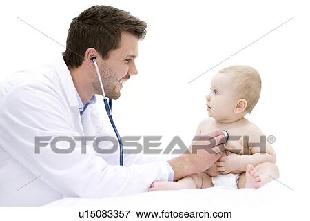 Doctor examining baby using stethoscope. View Large Photo Image Stock Photo - Doctor examining baby using stethoscope.. Fotosearch