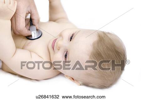 Doctor examining baby with stethoscope. View Large Photo Image Stock Image - Doctor examining baby with stethoscope.. Fotosearch