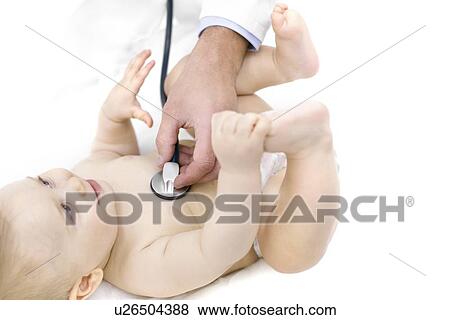 Doctor examining baby with stethoscope. View Large Photo Image Stock Photo - Doctor examining baby with stethoscope.. Fotosearch