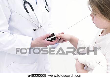 Doctor placing pulse oximeter on girl's finger. View Large Photo Image Stock Photo - Doctor placing pulse oximeter on girl's finger.. Fotosearch