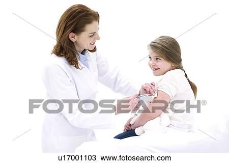 Female doctor injecting young girl in arm. View Large Photo Image Stock Image - Female doctor injecting young girl in arm.. Fotosearch